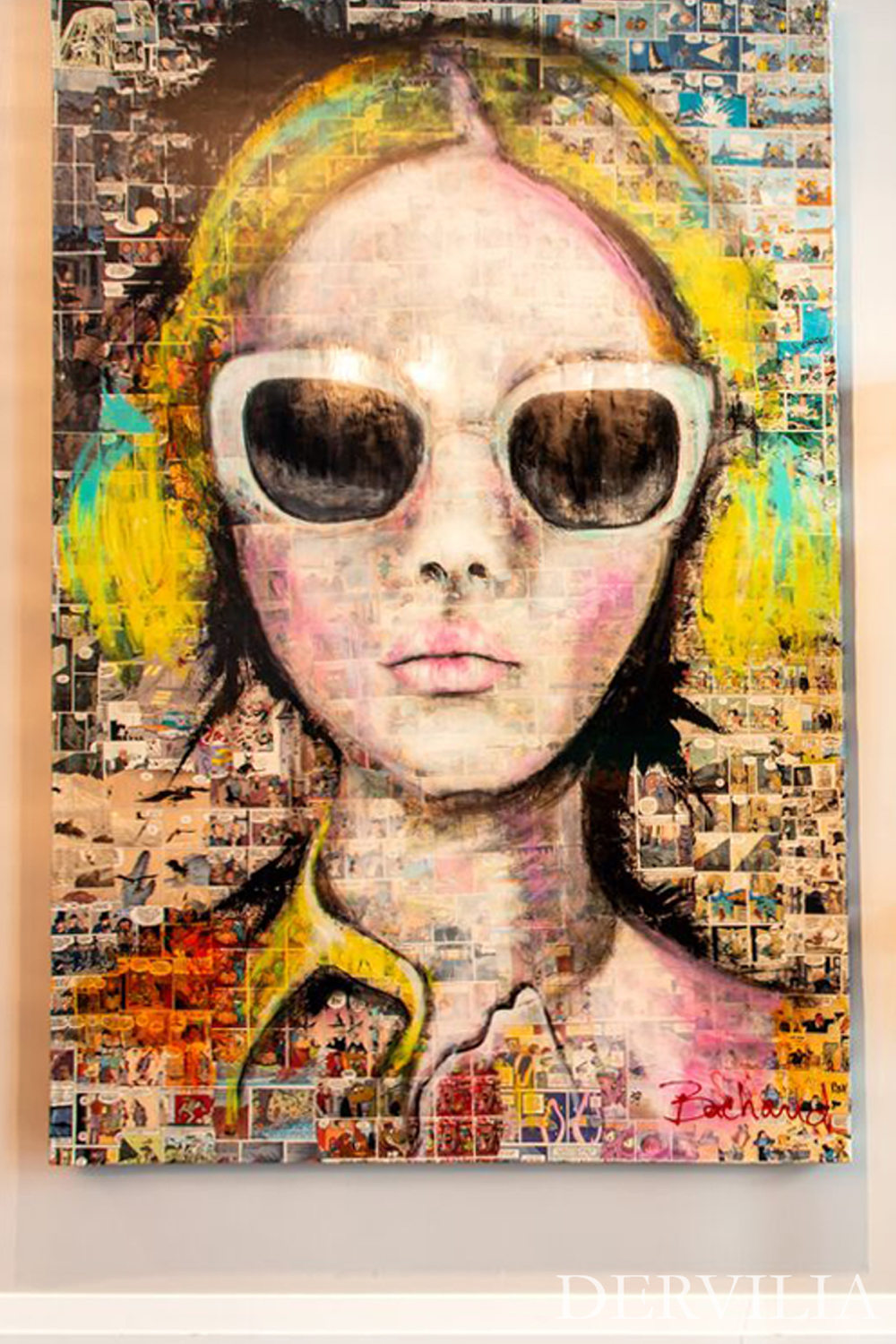 Large contemporary figurative artwork featuring a stylized portrait, paired with a glass console table and sculptural objects, showcasing Dervilia’s art-led approach to contrast, expression, and curated modern interiors.